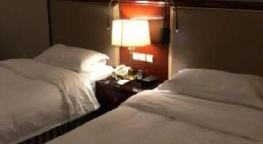 Bed in Xinhai Jinjiang Hotel