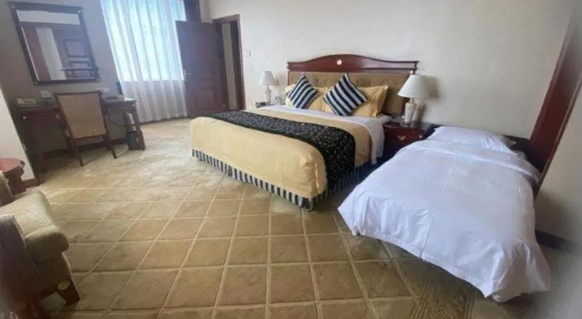 Bed in Xinhai Jinjiang Hotel