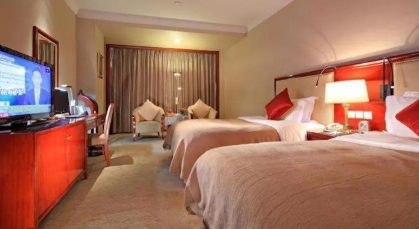 Bed in Xinhai Jinjiang Hotel