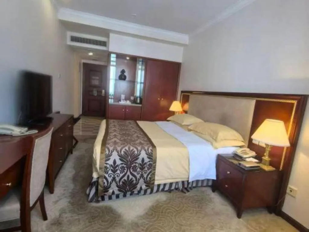 Bed in Xinhai Jinjiang Hotel