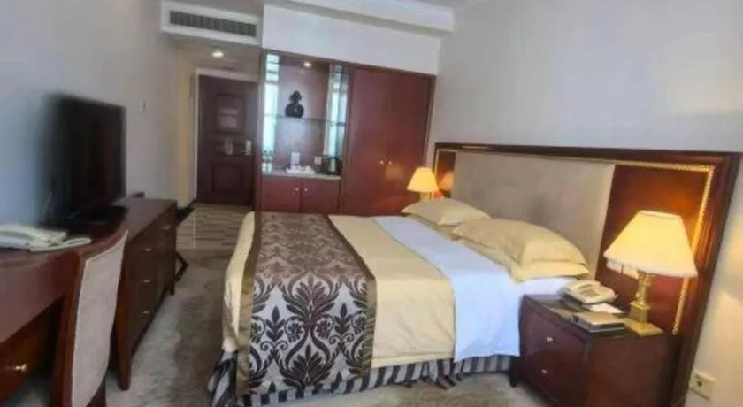 Bed in Xinhai Jinjiang Hotel