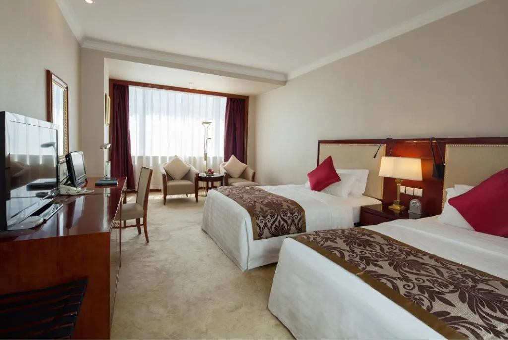 Bed in Xinhai Jinjiang Hotel