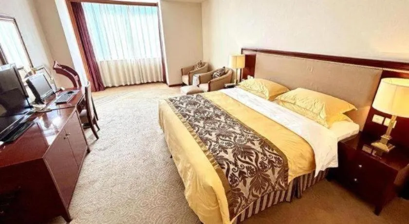 Bed in Xinhai Jinjiang Hotel