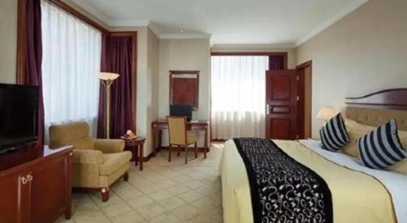 Bed in Xinhai Jinjiang Hotel