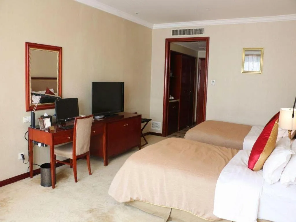 Bed in Xinhai Jinjiang Hotel