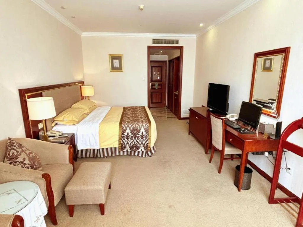 Bed in Xinhai Jinjiang Hotel