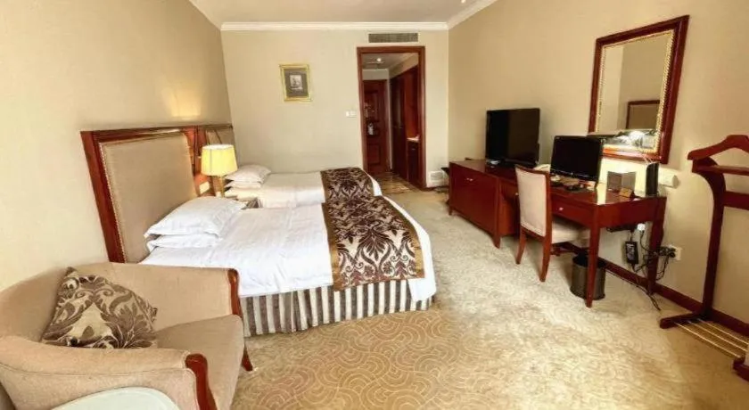 Bed in Xinhai Jinjiang Hotel