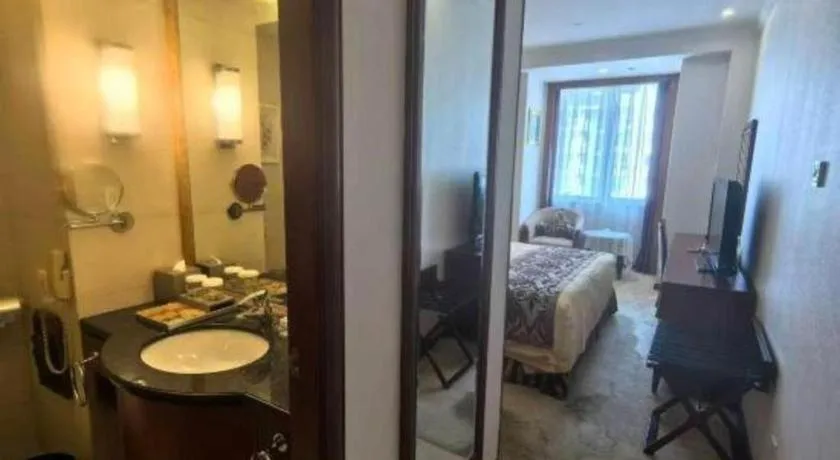 Bed in Xinhai Jinjiang Hotel