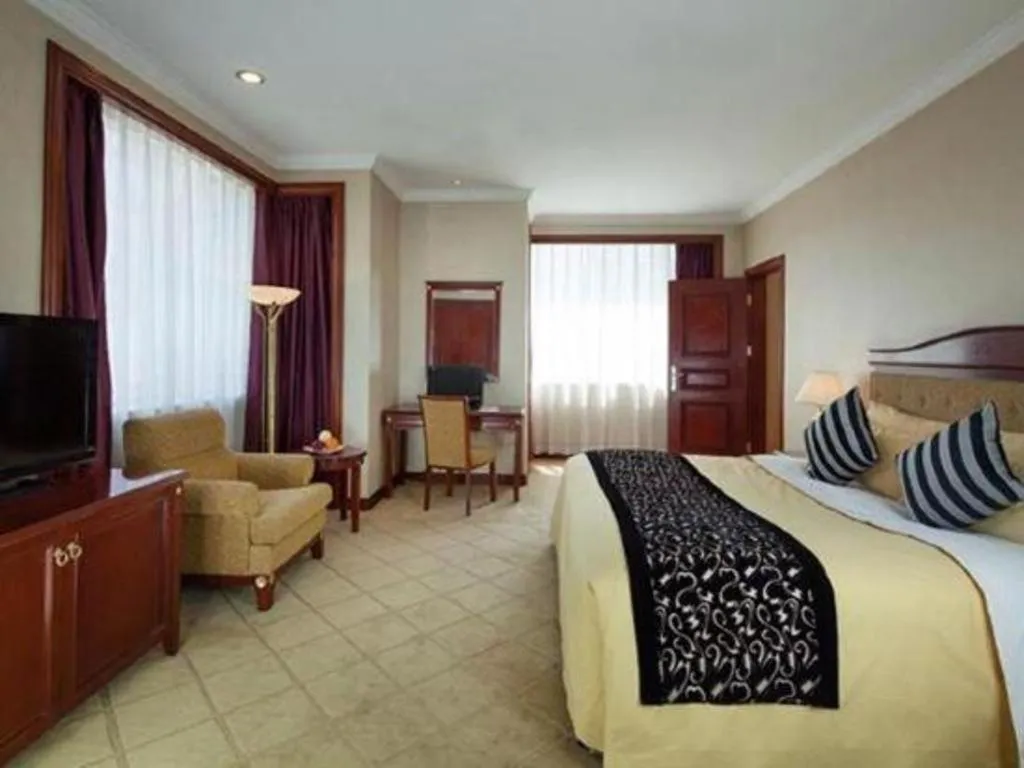 Bed in Xinhai Jinjiang Hotel