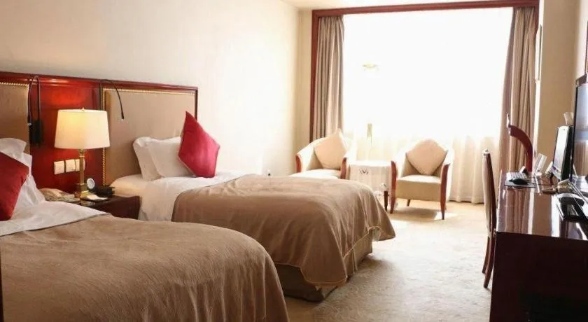 Bed in Xinhai Jinjiang Hotel
