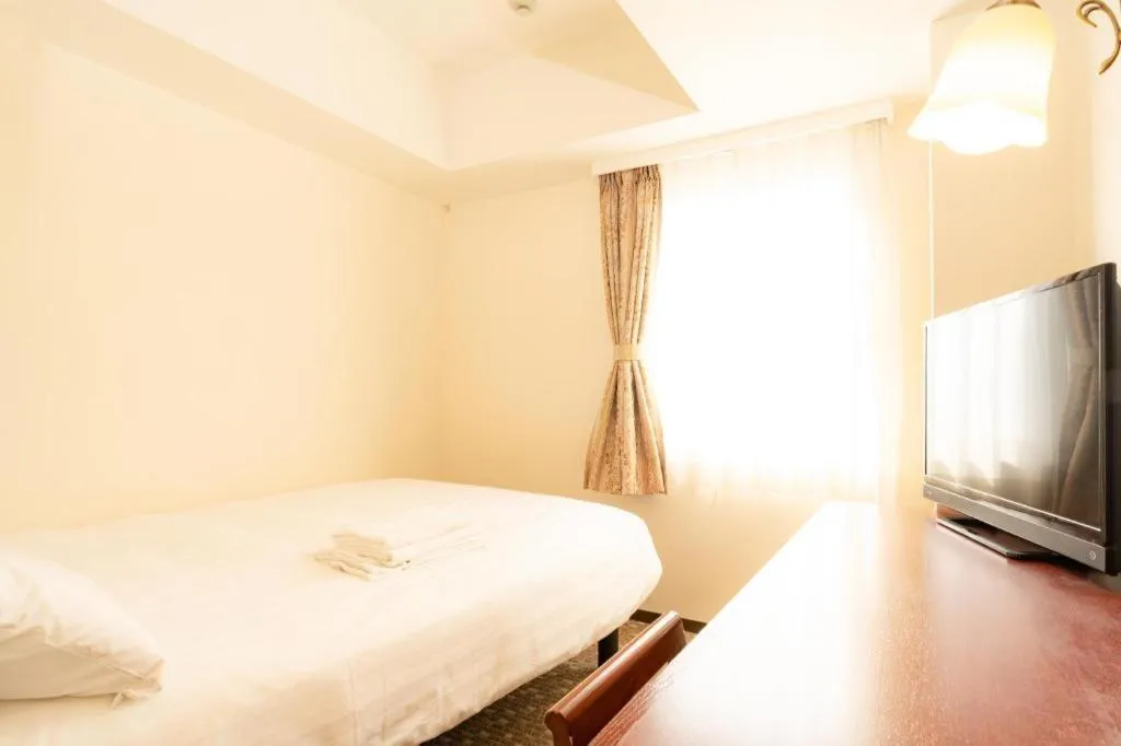 Bed in Smile Hotel Nishiakashi