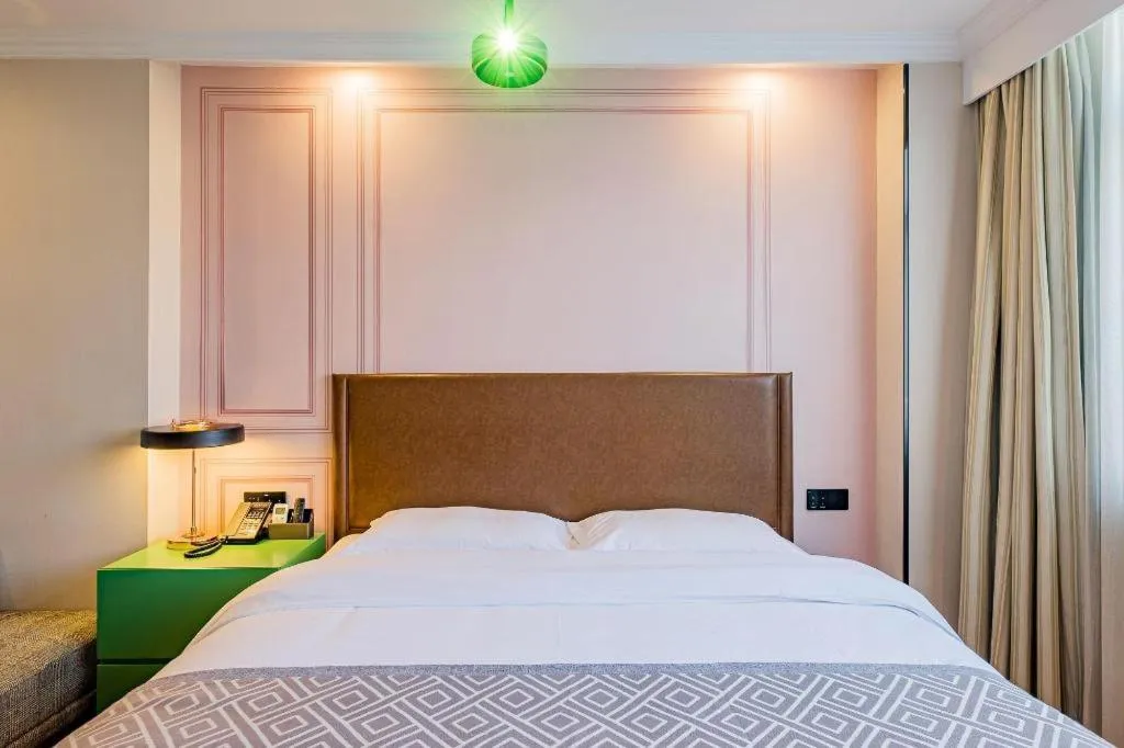 Bed in GME NanJing CaoChanGMEn Nanyihou Stress Hotel