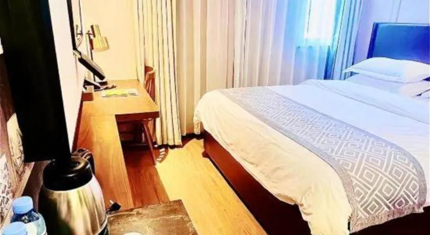 Bed in GME NanJing CaoChanGMEn Nanyihou Stress Hotel