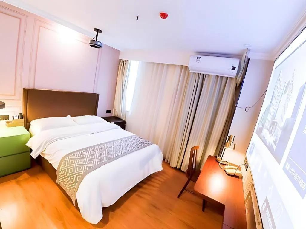 Bed in GME NanJing CaoChanGMEn Nanyihou Stress Hotel