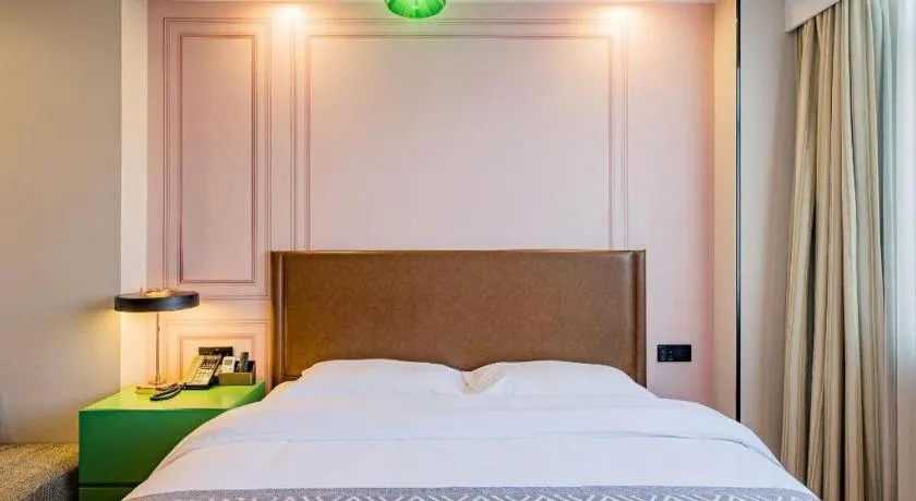 Bed in GME NanJing CaoChanGMEn Nanyihou Stress Hotel