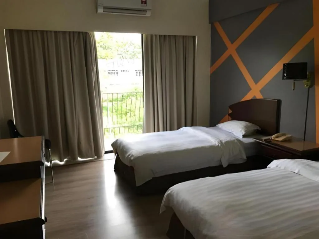 Bed in Casuarina Hotel