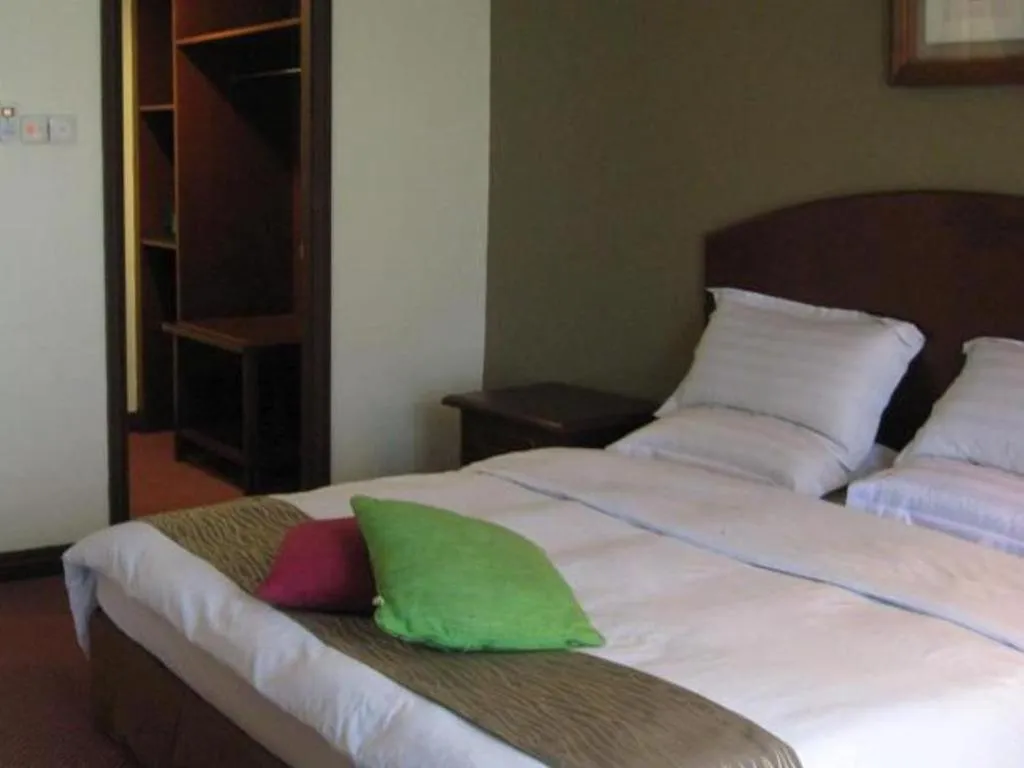 Bed in Casuarina Hotel