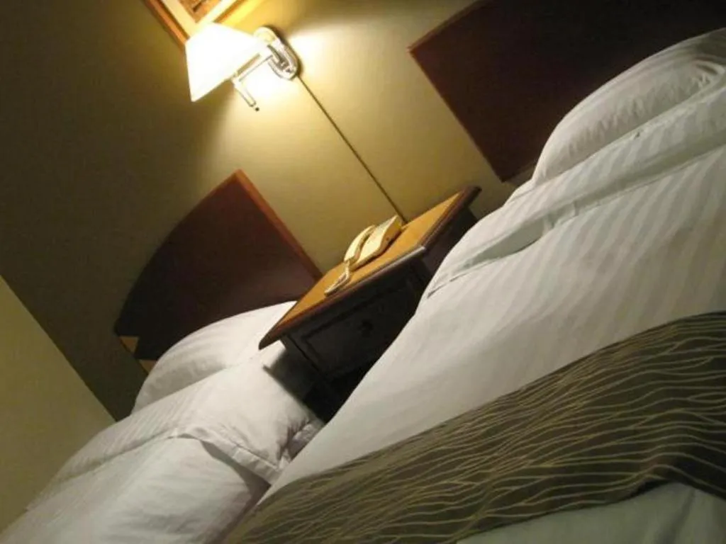 Bed in Casuarina Hotel