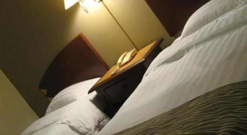 Bed in Casuarina Hotel