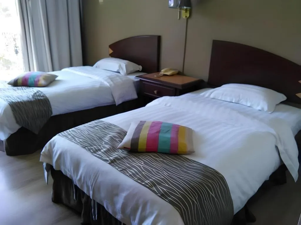 Bed in Casuarina Hotel
