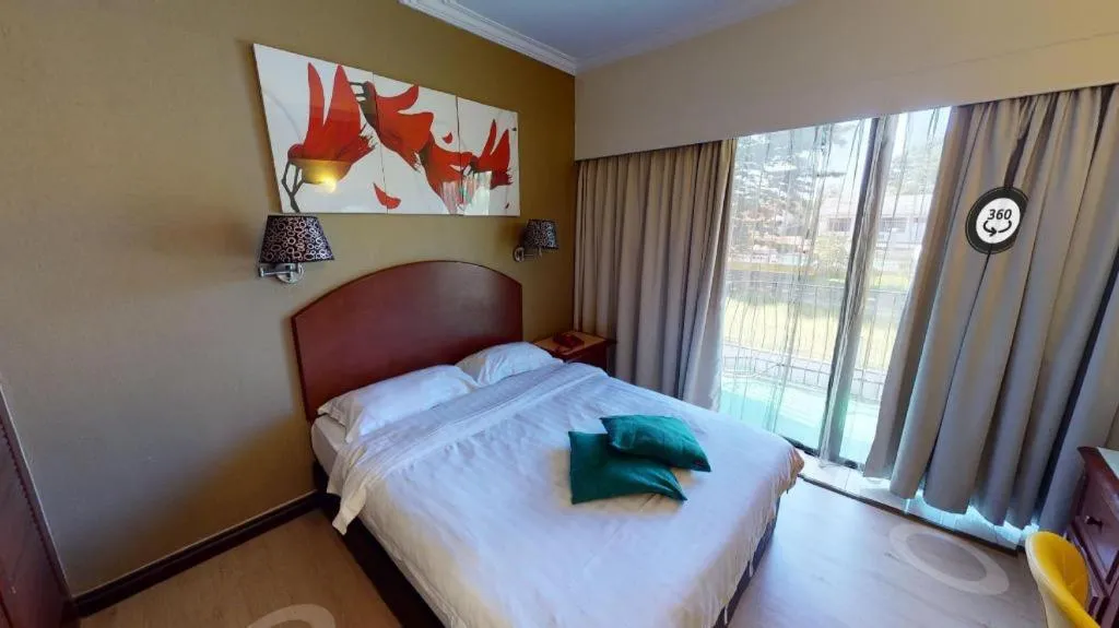 Bed in Casuarina Hotel