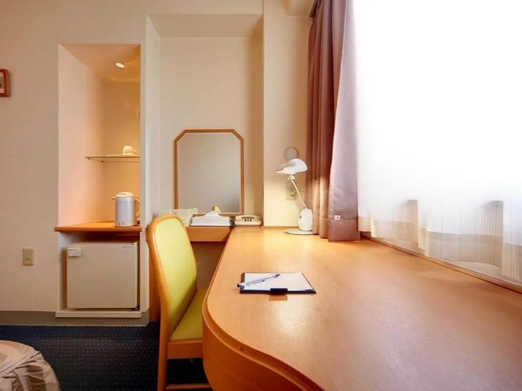 Bed in Roco Inn Matsuyama