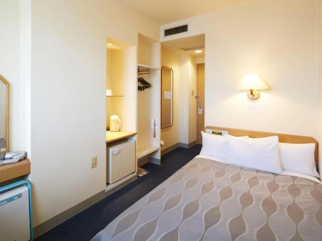 Bed in Roco Inn Matsuyama