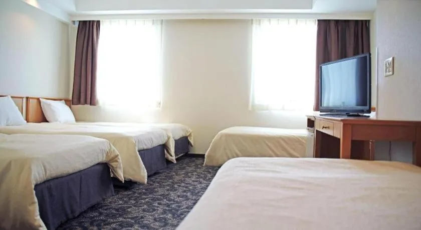 Bed in Nansei Kanko Hotel