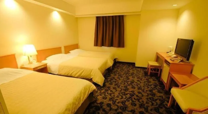 Bed in Nansei Kanko Hotel