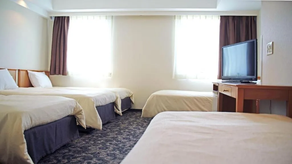 Bed in Nansei Kanko Hotel