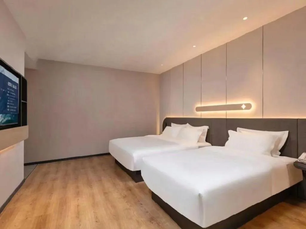 Bed in Jinjiang Inn Hangzhou Lin'an Qianwang Street