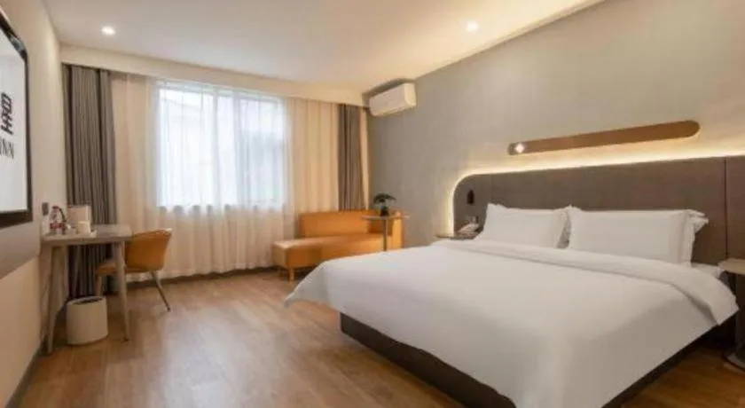 Bed in Jinjiang Inn Hangzhou Lin'an Qianwang Street