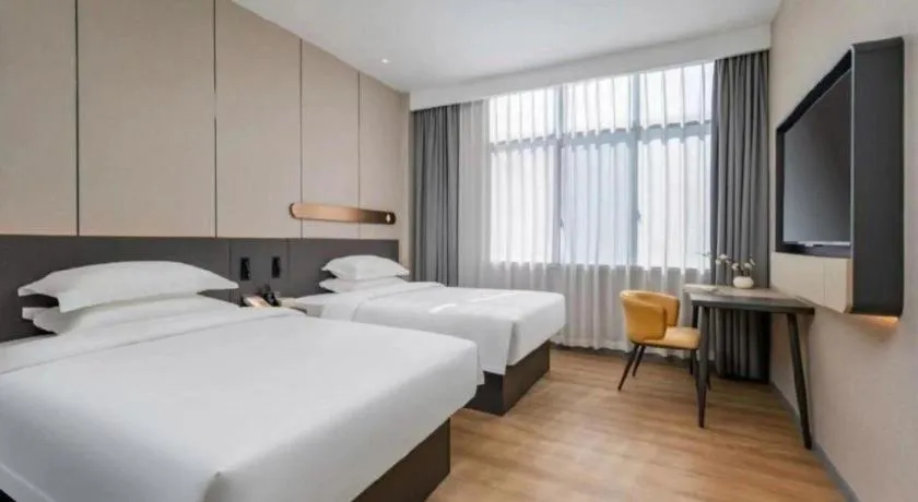 Bed in Jinjiang Inn Hangzhou Lin'an Qianwang Street