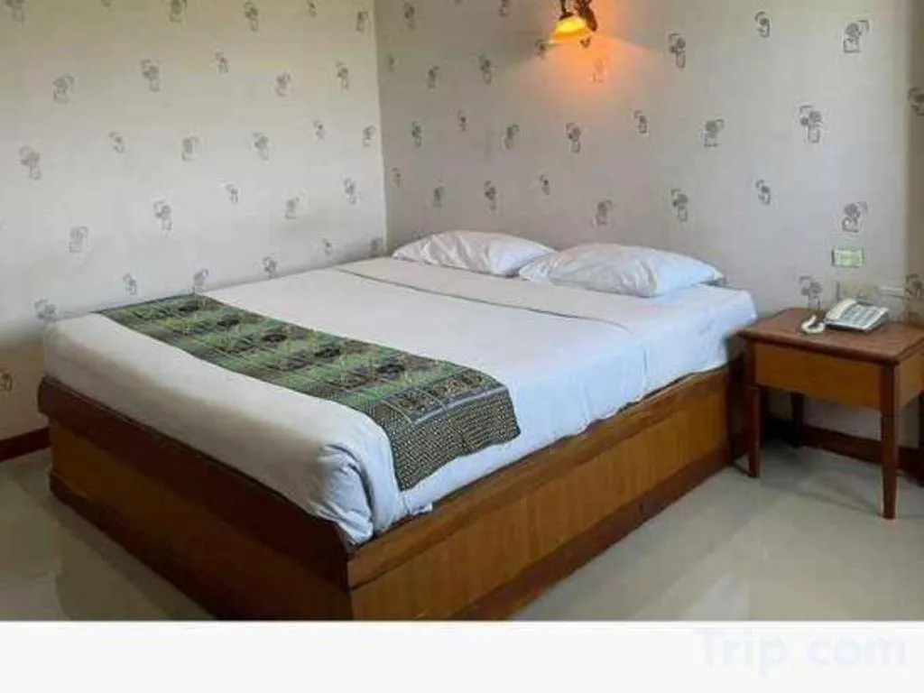 Bed in Sakol Grand Palace Hotel