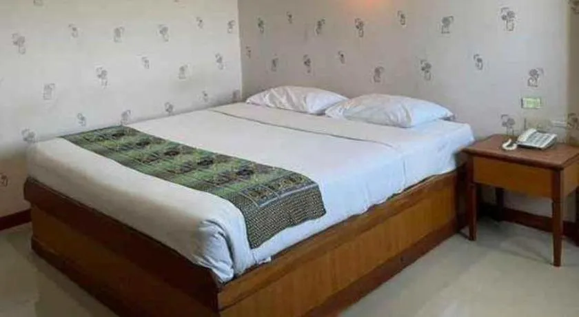 Bed in Sakol Grand Palace Hotel