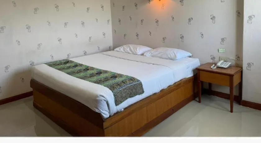 Bed in Sakol Grand Palace Hotel