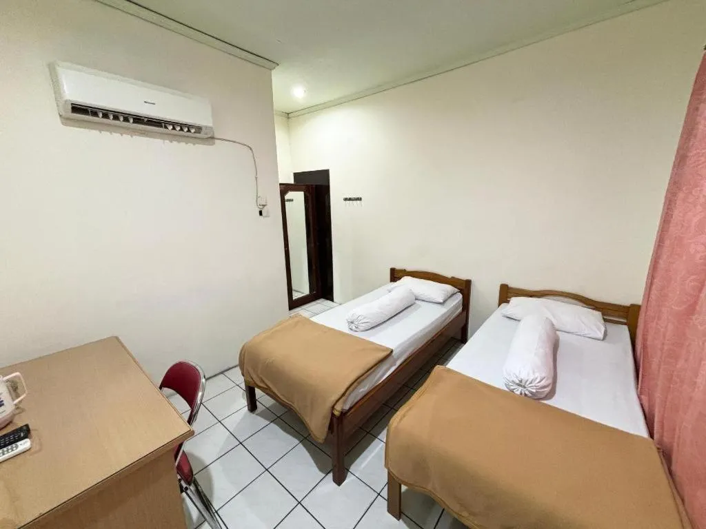 Bed in Sumber Ria Hotel