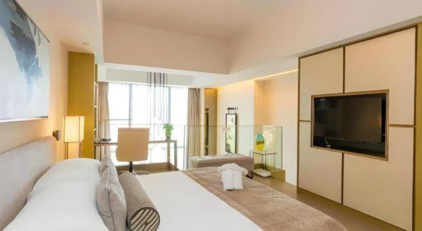 Bed in Huafa Executive Apartment Hotel Zhuhai