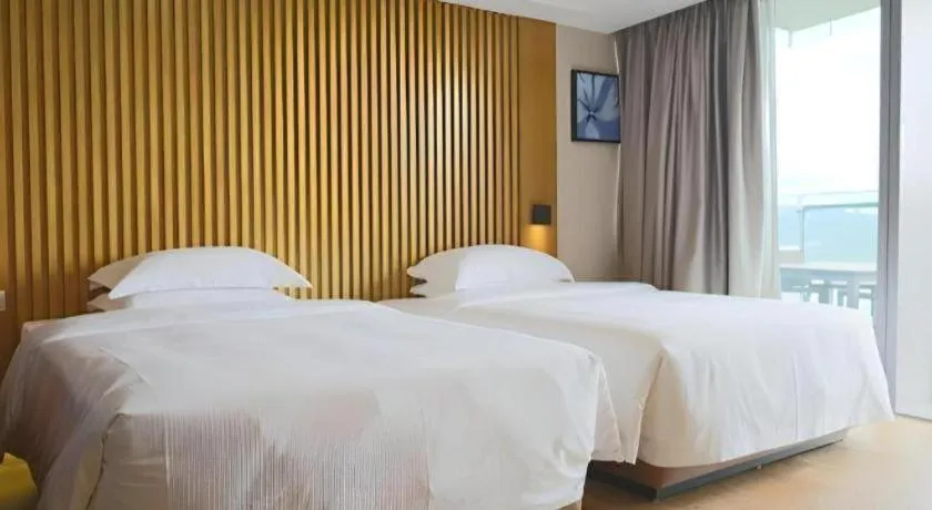 Bed in Huafa Executive Apartment Hotel Zhuhai