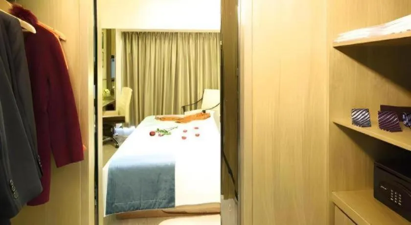 Bed in Huafa Executive Apartment Hotel Zhuhai