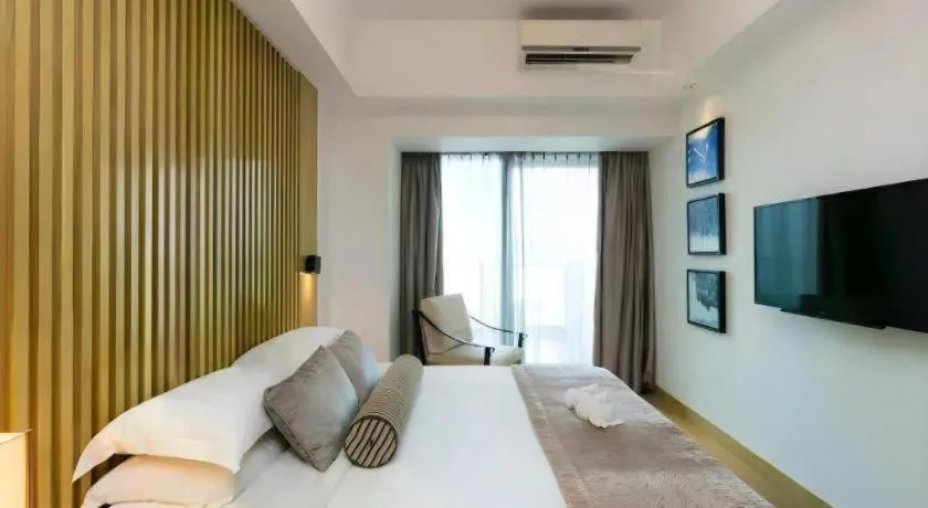 Bed in Huafa Executive Apartment Hotel Zhuhai