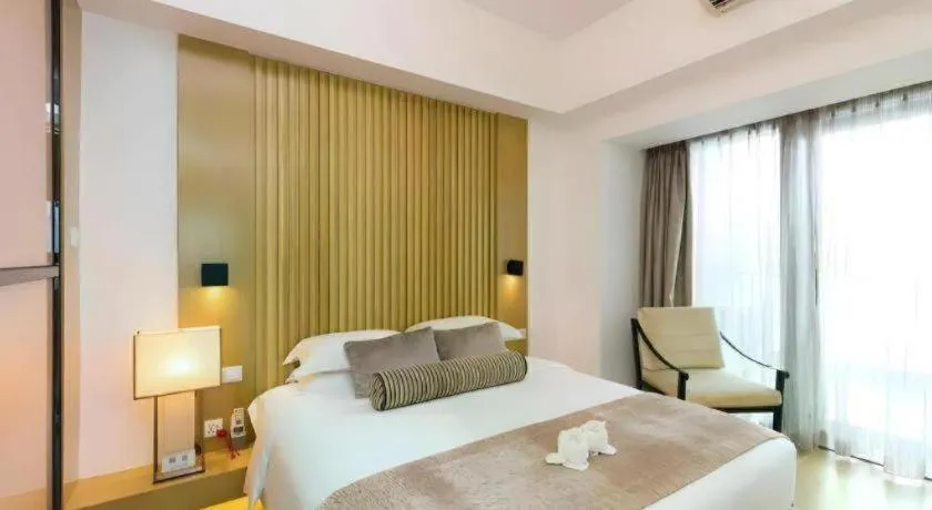 Bed in Huafa Executive Apartment Hotel Zhuhai