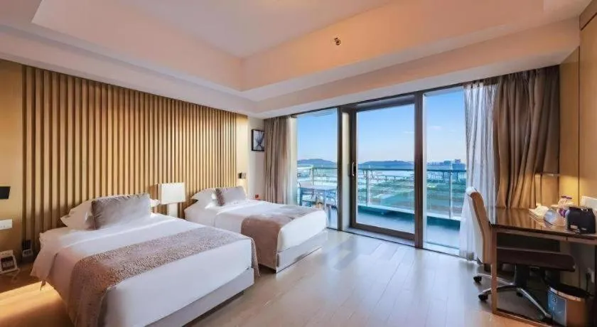 Bed in Huafa Executive Apartment Hotel Zhuhai