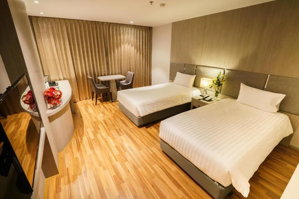 Bed in New Season Square Hotel