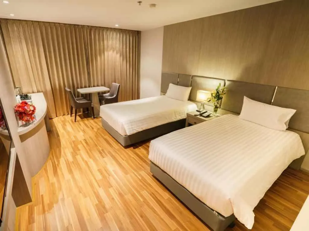 Bed in New Season Square Hotel