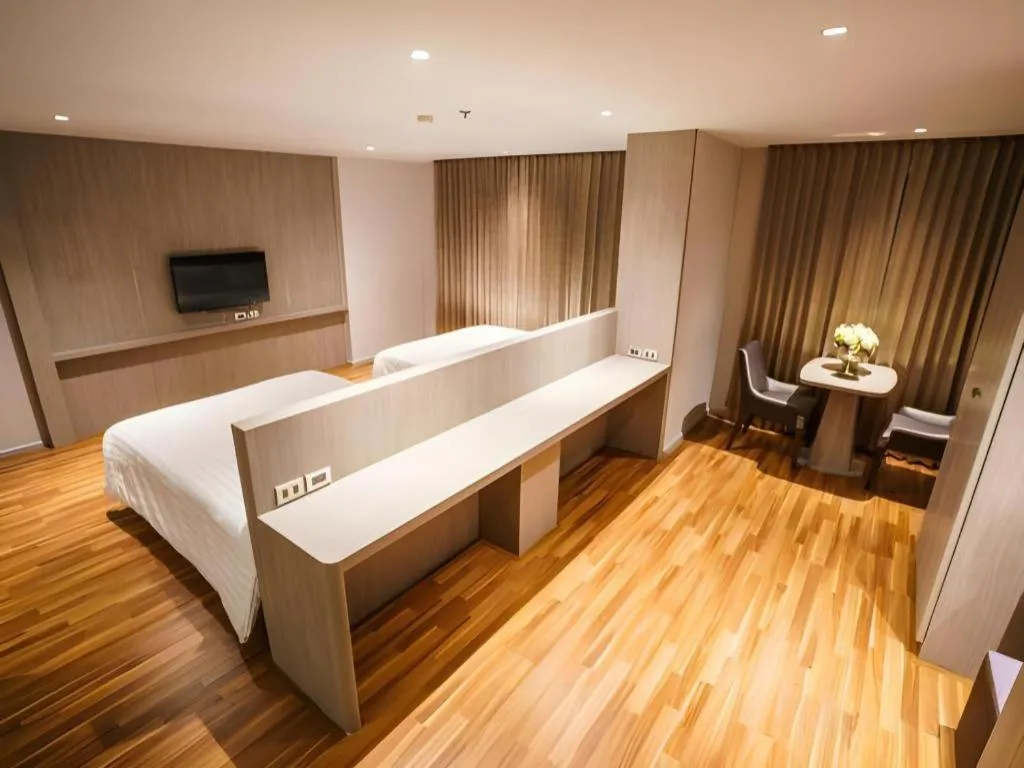 Bed in New Season Square Hotel