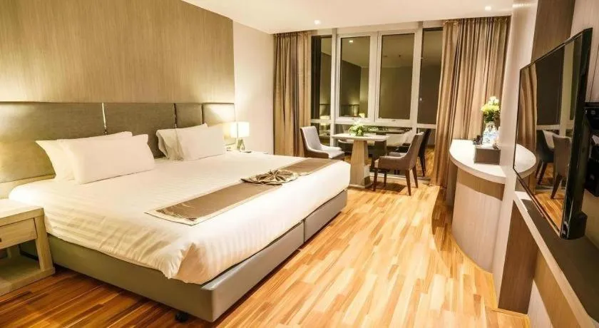 Bed in New Season Square Hotel