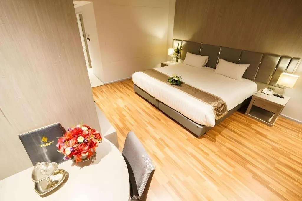 Bed in New Season Square Hotel