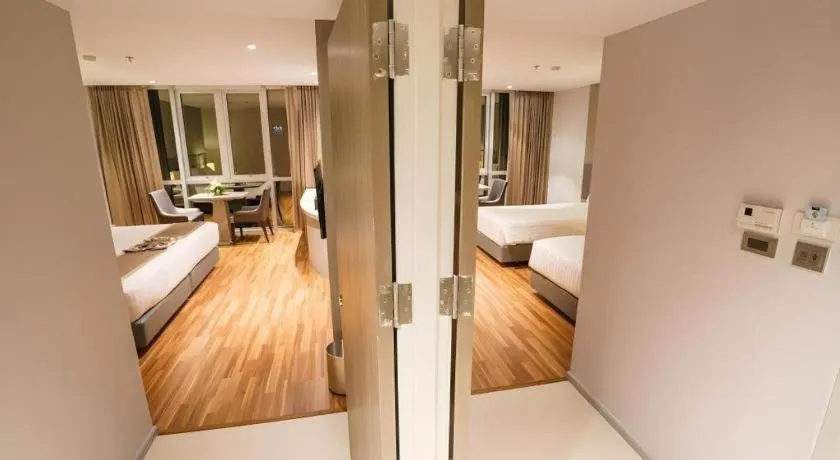 Bed in New Season Square Hotel