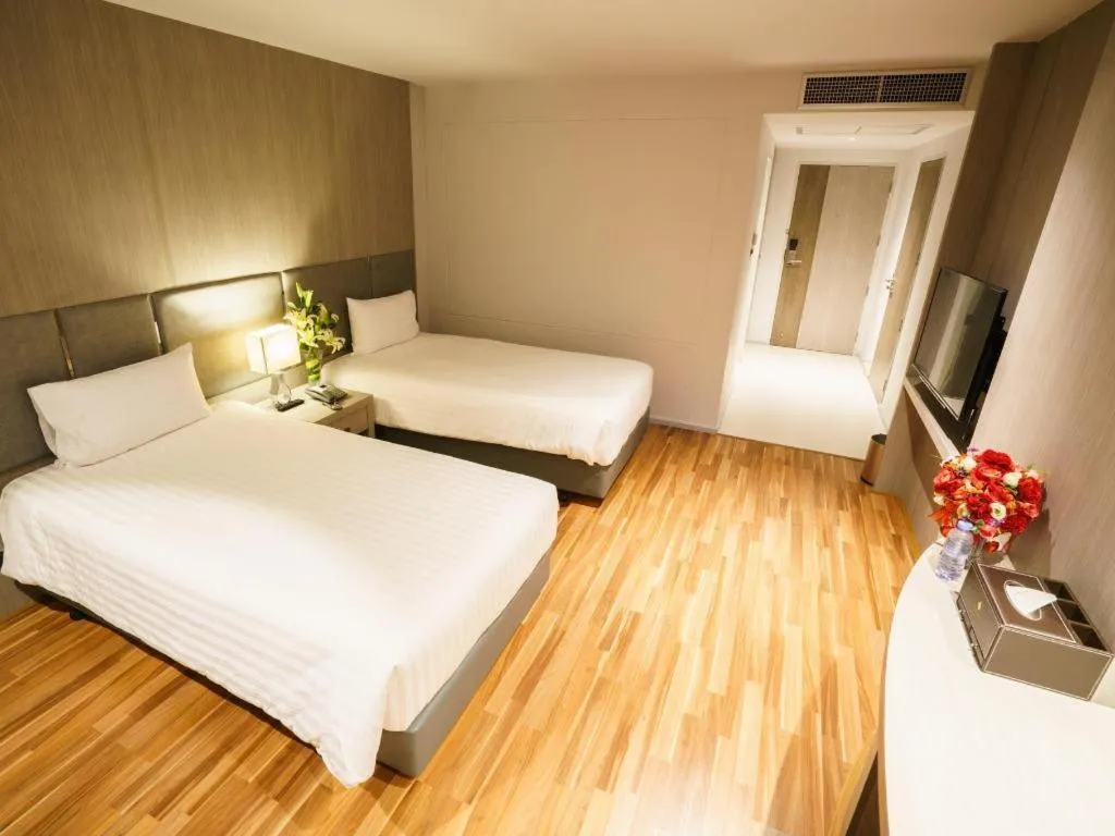 Bed in New Season Square Hotel